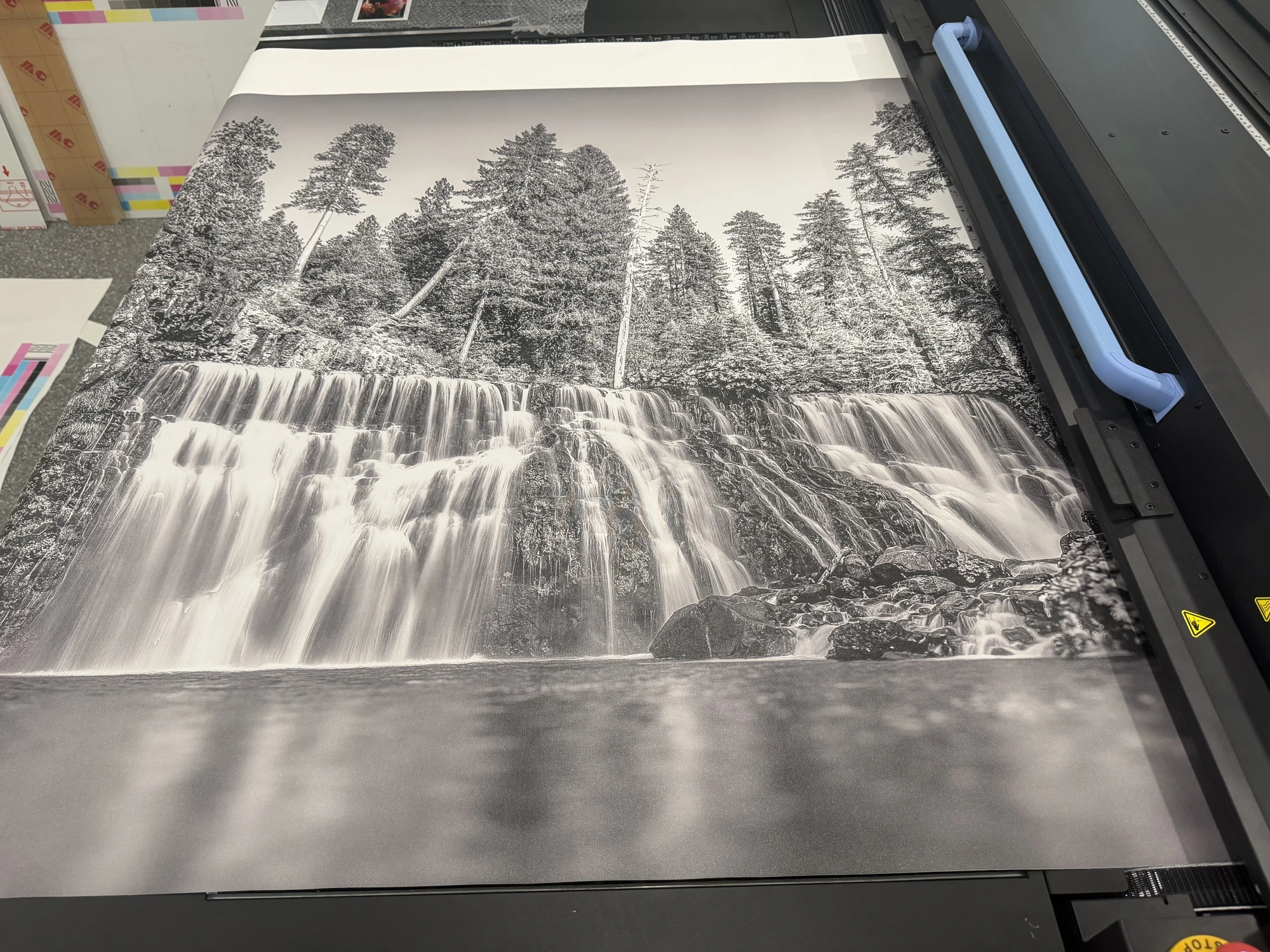 Waterfall and forest wall mural fresh off the large-format press